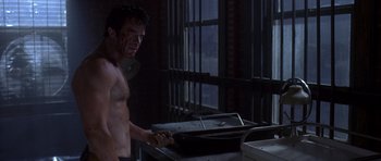 Movie still from “The Punisher” (2004), directed by Jonathan Hensleigh – A shirtless man standing in front of a sink; Medium shot, High angle
