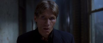 Movie still from “The Punisher” (2004), directed by Jonathan Hensleigh – A person wearing a suit and tie; Close Up shot, Low angle