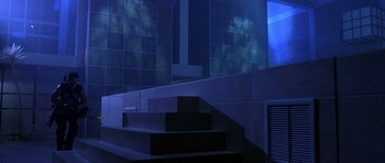 Movie still from “The Punisher” (2004), directed by Jonathan Hensleigh – A staircase in a room with blue tiles and a window; Extreme Wide shot, Low angle