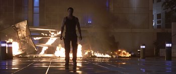 Movie still from “The Punisher” (2004), directed by Jonathan Hensleigh – A man standing in front of a burning building; Wide shot, Low angle