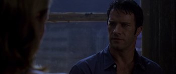 Movie still from “The Punisher” (2004), directed by Jonathan Hensleigh – A person wearing a blue shirt; Close Up shot, Over the shoulder angle