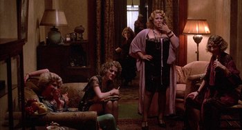 Movie still from “The Purple Rose of Cairo” (1985), directed by Woody Allen – A group of people in a living room; Wide shot, High angle