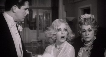 Movie still from “The Purple Rose of Cairo” (1985), directed by Woody Allen – An old photo of a woman in a white dress; Close Up shot, Over the shoulder angle