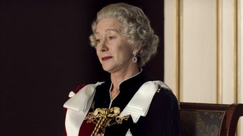 Movie still from “The Queen” (2006), directed by Stephen Frears – An older woman wearing a black and white outfit; Close Up shot, Low angle