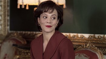 Movie still from “The Queen” (2006), directed by Stephen Frears – A person sitting in a chair; Close Up shot, Over the shoulder angle