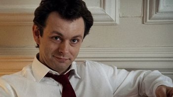 Movie still from “The Queen” (2006), directed by Stephen Frears – A person wearing a shirt and a tie; Close Up shot, High angle
