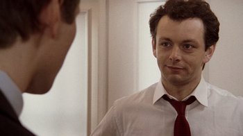Movie still from “The Queen” (2006), directed by Stephen Frears – A man wearing a red tie looking at himself in the mirror; Close Up shot, Over the shoulder angle