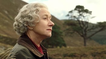 Movie still from “The Queen” (2006), directed by Stephen Frears – An older woman looking off into the distance; Close Up shot, Low angle