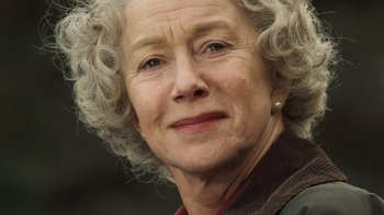Movie still from “The Queen” (2006), directed by Stephen Frears – An older woman with curly gray hair looking at the camera; Close Up shot, Low angle