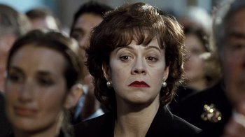 Movie still from “The Queen” (2006), directed by Stephen Frears – A person wearing a suit and tie; Close Up shot, Over the shoulder angle