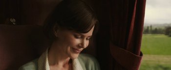 Movie still from “The Railway Man” (2013), directed by Jonathan Teplitzky – A woman's face in a dark room; Close Up shot, Over the shoulder angle
