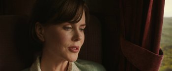 Movie still from “The Railway Man” (2013), directed by Jonathan Teplitzky – A woman's face in a dark room; Close Up shot, Over the shoulder angle