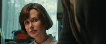 Movie still from “The Railway Man” (2013), directed by Jonathan Teplitzky – A person with short brown hair; Close Up shot, Over the shoulder angle