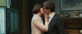 Movie still from “The Railway Man” (2013), directed by Jonathan Teplitzky – A man and a woman kissing each other in front of a wall; Close Up shot, Low angle