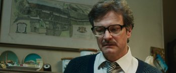 Movie still from “The Railway Man” (2013), directed by Jonathan Teplitzky – A person wearing glasses and a tie; Close Up shot, Over the shoulder angle