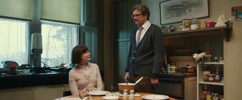 Movie still from “The Railway Man” (2013), directed by Jonathan Teplitzky – A man and a woman sitting at a dinner table; Medium shot, Low angle