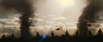 Movie still from “The Railway Man” (2013), directed by Jonathan Teplitzky – A group of men standing on top of a grass covered field; Extreme Wide shot, Low angle