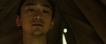 Movie still from “The Railway Man” (2013), directed by Jonathan Teplitzky – A man's face in the dark; Close Up shot, Low angle