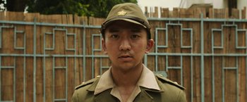 Movie still from “The Railway Man” (2013), directed by Jonathan Teplitzky – A man wearing a uniform and a hat; Close Up shot, Low angle