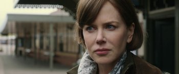 Movie still from “The Railway Man” (2013), directed by Jonathan Teplitzky – A person wearing a scarf; Close Up shot, Over the shoulder angle
