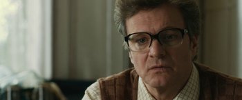 Movie still from “The Railway Man” (2013), directed by Jonathan Teplitzky – An older man wearing glasses and a sweater; Close Up shot, Over the shoulder angle