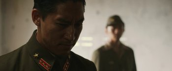 Movie still from “The Railway Man” (2013), directed by Jonathan Teplitzky – A man in a military uniform looking down at his face; Close Up shot, Over the shoulder angle