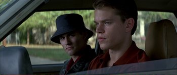 Movie still from “The Rainmaker” (1997), directed by Francis Ford Coppola – Two men in a car looking out of the window; Close Up shot, Over the shoulder angle