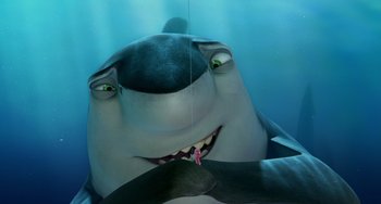 Movie still from “Shark Tale” (2004), directed by Vicky Jenson – A shark with its tongue hanging out of its mouth; Close Up shot, High angle