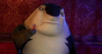 Movie still from “Shark Tale” (2004), directed by Vicky Jenson – A person holding a small crab; Close Up shot, High angle