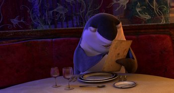 Movie still from “Shark Tale” (2004), directed by Vicky Jenson – An animated character sitting at a dinner table reading a menu; Close Up shot, High angle