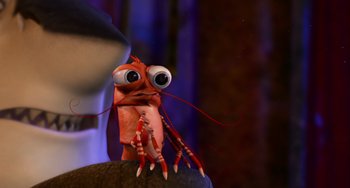 Movie still from “Shark Tale” (2004), directed by Vicky Jenson – An animated creature with big eyes and long legs; Close Up shot, High angle