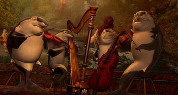Movie still from “Shark Tale” (2004), directed by Vicky Jenson – A group of animals that are playing musical instruments; Wide shot, Low angle