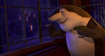 Movie still from “Shark Tale” (2004), directed by Vicky Jenson – A shark is standing in front of a window; Medium shot, High angle