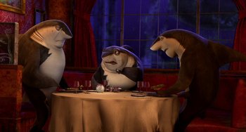 Movie still from “Shark Tale” (2004), directed by Vicky Jenson – A group of sharks sitting at a table with wine glasses; Medium shot, High angle