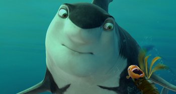 Movie still from “Shark Tale” (2004), directed by Vicky Jenson – A fish and a person in the water; Close Up shot, Low angle