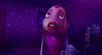 Movie still from “Shark Tale” (2004), directed by Vicky Jenson – An image of an animated fish in a purple room; Close Up shot, Low angle