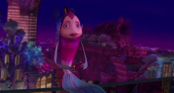 Movie still from “Shark Tale” (2004), directed by Vicky Jenson – A pink and purple fish is in the water; Medium shot, Low angle