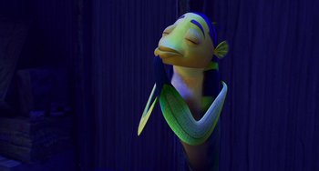 Movie still from “Shark Tale” (2004), directed by Vicky Jenson – A sculpture of a fish with a blue background; Close Up shot, High angle