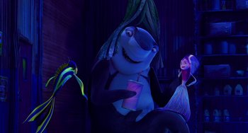 Movie still from “Shark Tale” (2004), directed by Vicky Jenson – A woman and a fish in a dark room; Medium shot, Over the shoulder angle