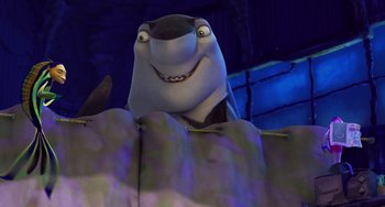 Movie still from “Shark Tale” (2004), directed by Vicky Jenson – A cartoon shark in a cave; Medium shot, Low angle