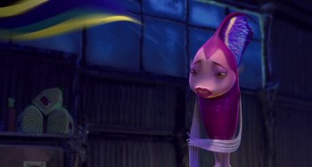 Movie still from “Shark Tale” (2004), directed by Vicky Jenson – A pink fish with a long tail is standing in front of a window; Medium shot, Low angle