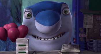 Movie still from “Shark Tale” (2004), directed by Vicky Jenson – A smiling shark with a red nose; Close Up shot, High angle