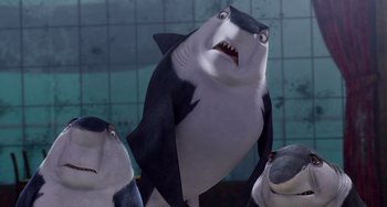 Movie still from “Shark Tale” (2004), directed by Vicky Jenson – A cartoon shark with its mouth wide open; Medium shot, Low angle