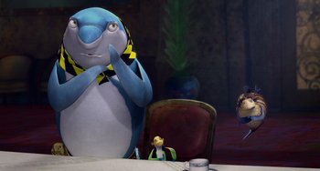 Movie still from “Shark Tale” (2004), directed by Vicky Jenson – A penguin sitting at a dinner table with a bird sitting on the table; Medium shot, Low angle