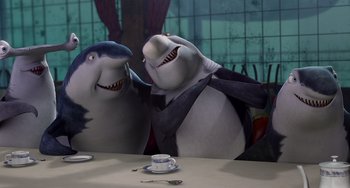 Movie still from “Shark Tale” (2004), directed by Vicky Jenson – Two sharks are sitting at a table in front of a mirror; Medium shot, High angle
