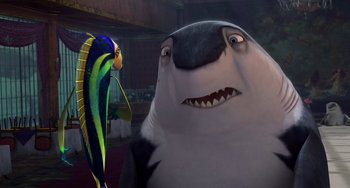 Movie still from “Shark Tale” (2004), directed by Vicky Jenson – A fish and a shark in a scene from the movie finding nemo; Close Up shot, Over the shoulder angle