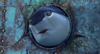 Movie still from “Shark Tale” (2004), directed by Vicky Jenson – The head of a shark in a hole; Close Up shot, High angle