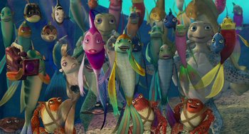 Movie still from “Shark Tale” (2004), directed by Vicky Jenson – A bunch of fish are in the water together; Wide shot, High angle
