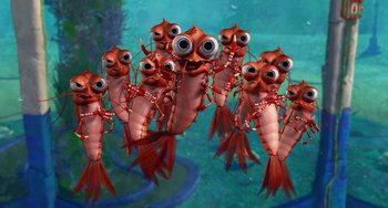 Movie still from “Shark Tale” (2004), directed by Vicky Jenson – A group of red lobsters are swimming in the water; Medium shot, High angle