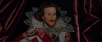 Movie still from “The Remains of the Day” (1993), directed by James Ivory – A painting of a man in a red jacket; Close Up shot, High angle